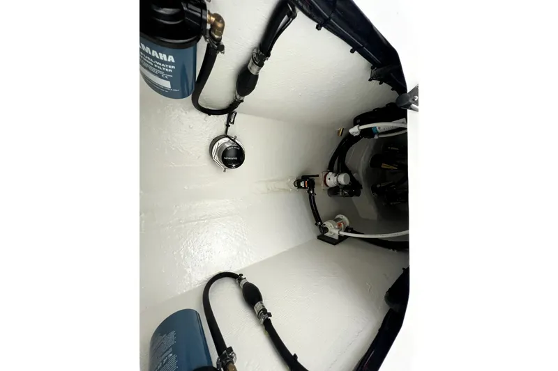 Slide: The Image of Interior view of 2026 Contender boat's engine compartment with Yamaha components. - 16