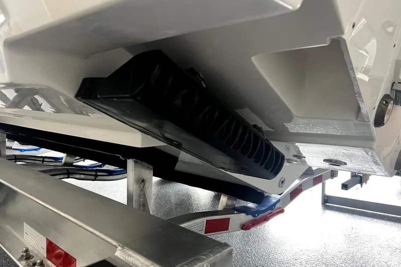 Slide: The Image of 2026 Contender 28 Tournament boat on trailer, close-up of hull and support structure. - 3