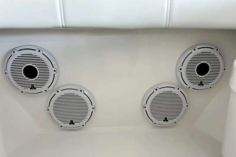 Slide: The Image of Four white JL Audio speakers on a Contender boat, model year 2026. - 5