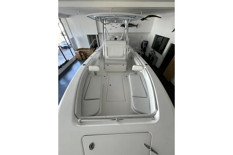 Slide: The Image of 2026 Contender boat interior with sleek seating and modern design in showroom. - 6