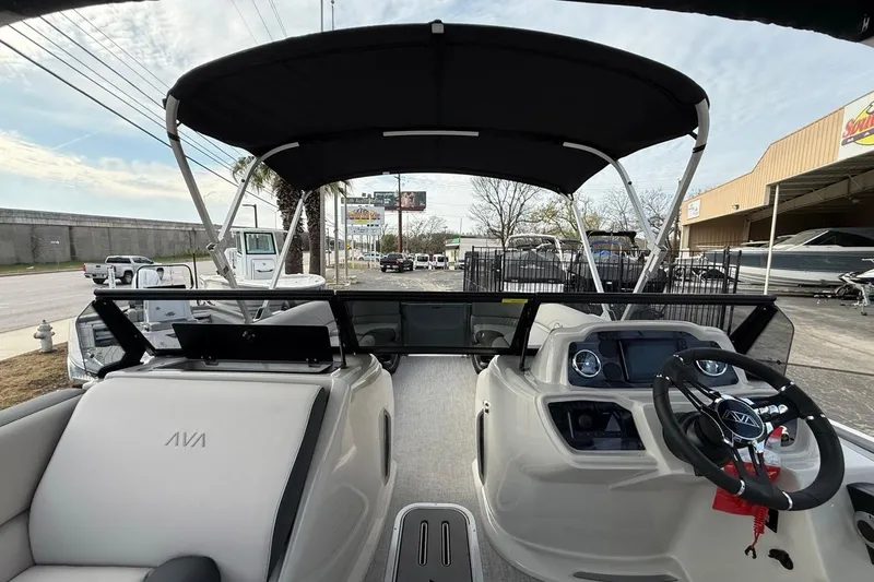 Slide: The Image of 2026 Avalon LSZ Versatile Rear Bench Windshield boat interior with steering wheel and seating. - 22