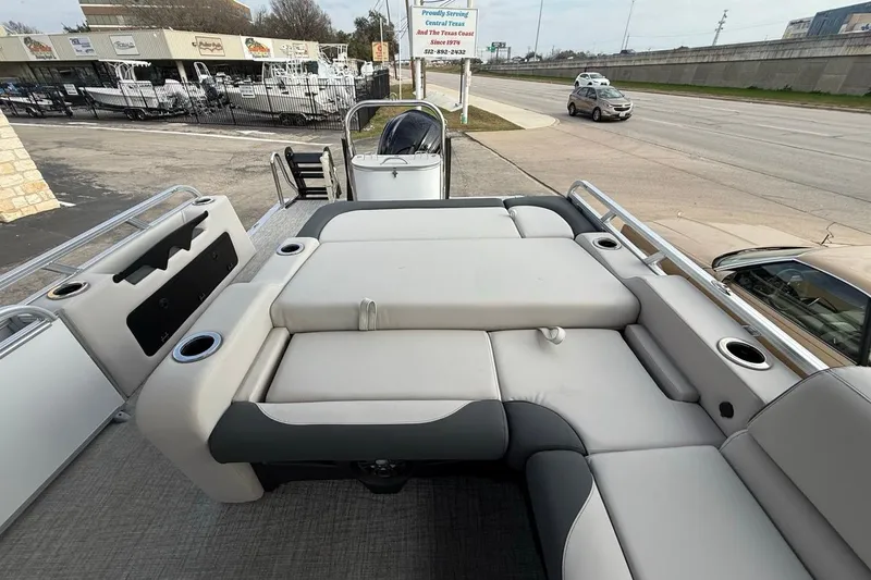Slide: The Image of 2026 Avalon LSZ Versatile Rear Bench Windshield boat with spacious seating and cup holders. - 33