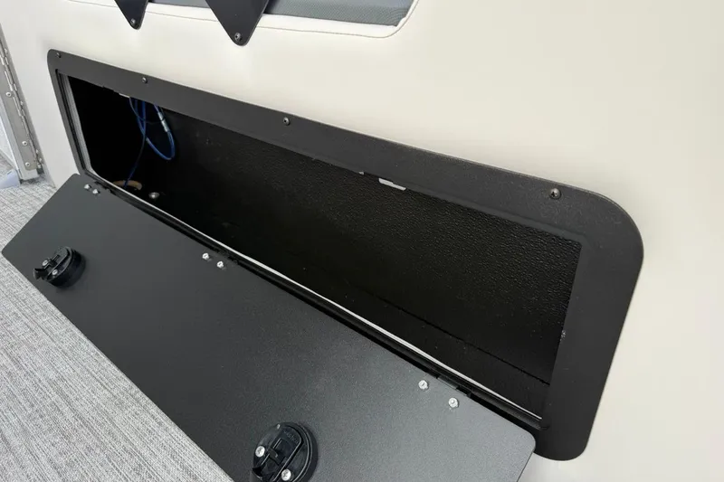 Slide: The Image of Storage compartment in 2026 Avalon LSZ Versatile Rear Bench Windshield boat. - 40