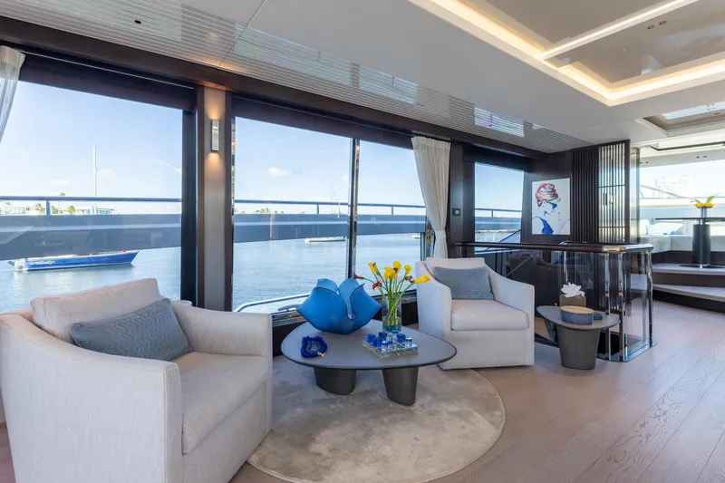 Slide: The Image of Luxurious interior of 2023 Sunseeker 90 Ocean yacht with elegant seating and waterfront view. - 13