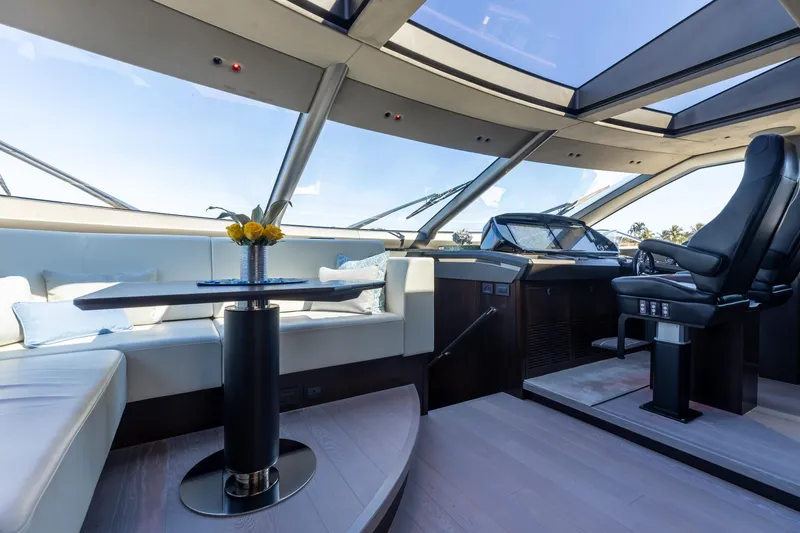 Slide: The Image of Luxurious interior of 2023 Sunseeker 90 Ocean yacht with panoramic windows and elegant seating. - 16