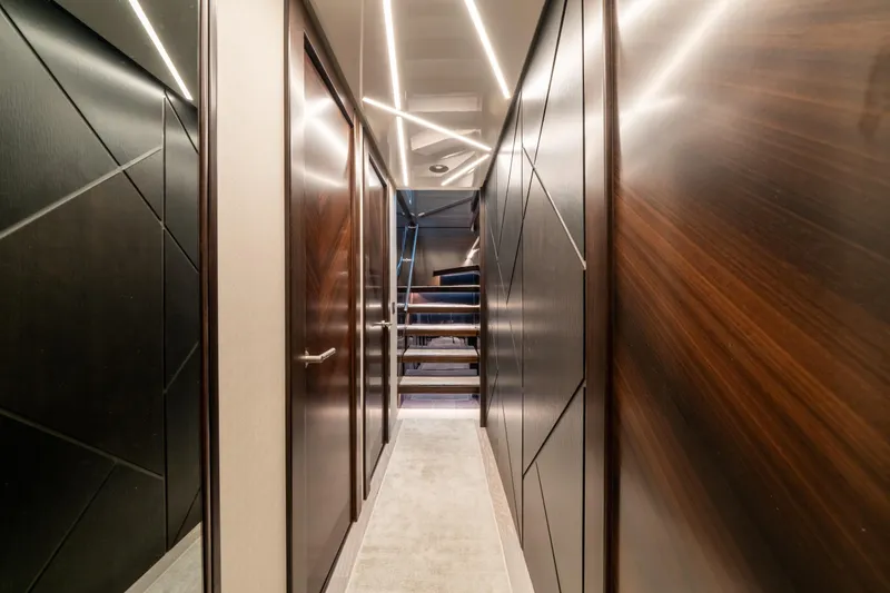 Slide: The Image of Luxurious interior hallway of 2023 Sunseeker 90 Ocean yacht with modern lighting. - 20