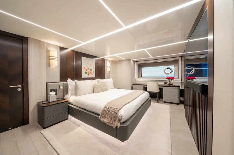 Slide: The Image of Luxurious bedroom interior of 2023 Sunseeker 90 Ocean yacht, featuring modern design and elegant decor. - 21