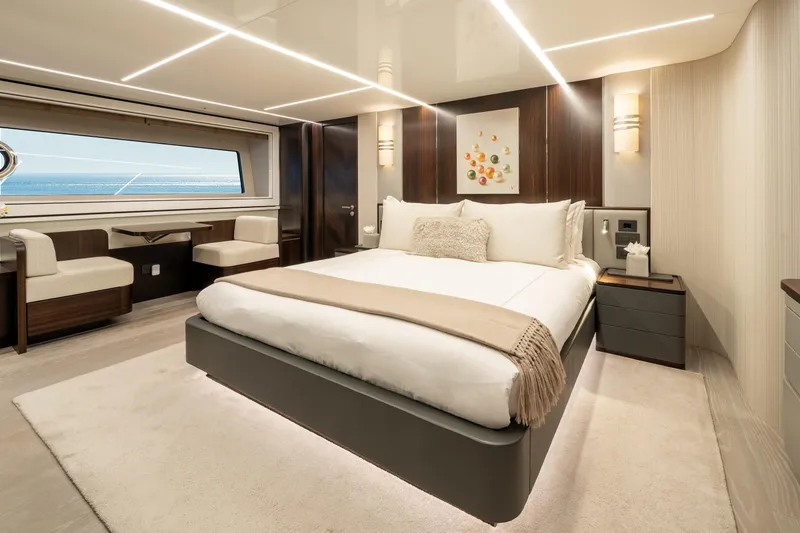 Slide: The Image of Luxurious bedroom interior on 2023 Sunseeker 90 Ocean yacht, featuring elegant design and ocean view. - 23
