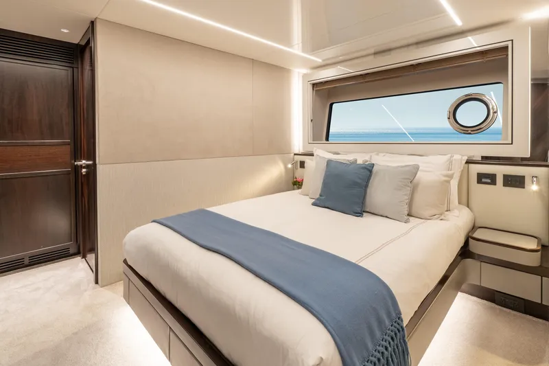 Slide: The Image of Luxurious bedroom interior of 2023 Sunseeker 90 Ocean yacht with ocean view. - 30