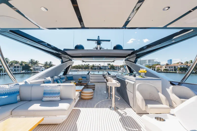 Slide: The Image of Luxurious 2023 Sunseeker 90 Ocean yacht interior with elegant seating and scenic waterfront view. - 34