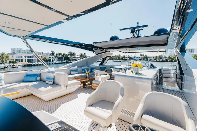 Slide: The Image of Luxurious 2023 Sunseeker 90 Ocean yacht deck with elegant seating and waterfront view. - 44