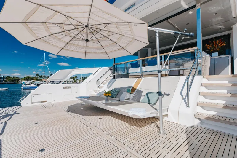 Slide: The Image of Luxurious 2023 Sunseeker 90 Ocean yacht deck with sunshade and seating area. - 7