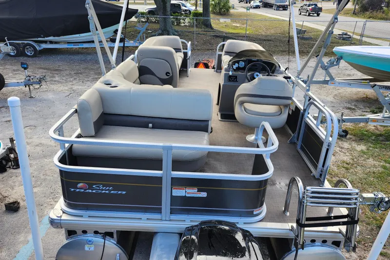Slide: The Image of 2023 Sun Tracker Party Barge 18 DLX pontoon boat with spacious seating and steering console. - 5