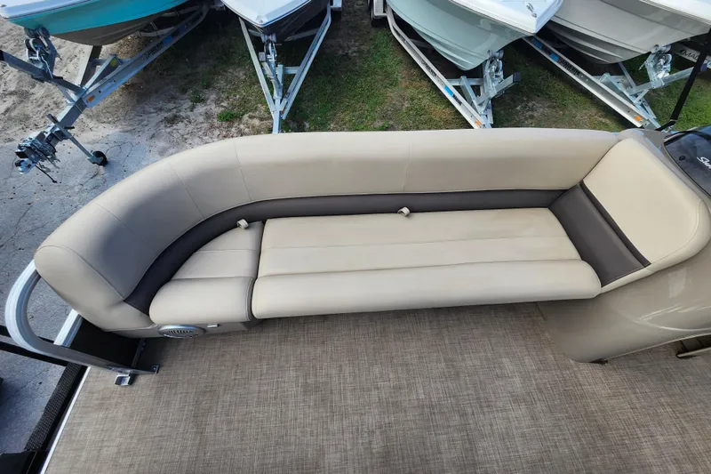 Slide: The Image of 2023 Sun Tracker Party Barge 18 DLX pontoon boat seating area, beige and gray upholstery. - 7