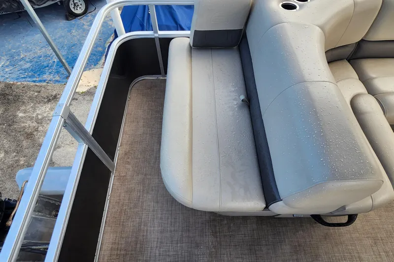 Slide: The Image of 2023 Sun Tracker Party Barge 18 DLX interior with wet seating and cup holders. - 9