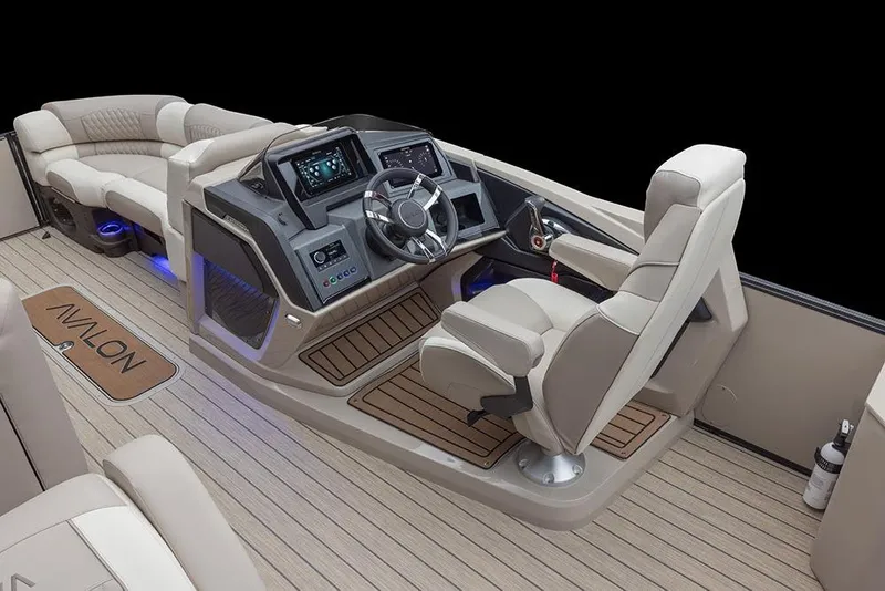 Slide: The Image of 2026 Avalon Excalibur LTD Quad Lounger Shift boat with powerful V6 engine, rear view. - 10