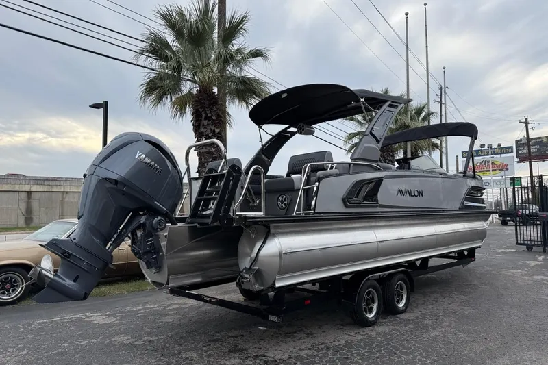 Slide: The Image of 2026 Avalon Excalibur LTD Quad Lounger Shift pontoon boat with Yamaha outboard motor. - 11