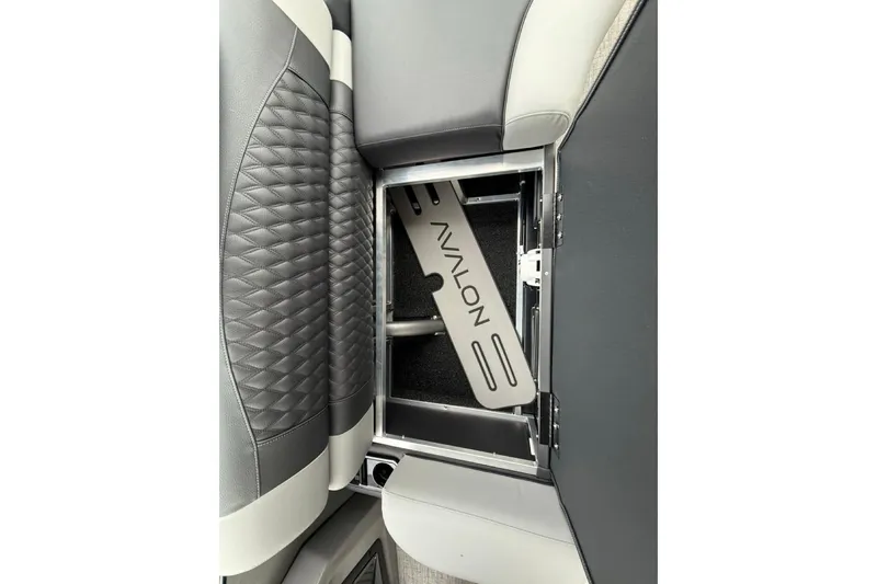 Slide: The Image of 2026 Avalon Excalibur LTD Quad Lounger Shift seat storage compartment, featuring sleek design and functionality. - 27
