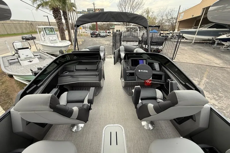 Slide: The Image of Interior of 2026 Avalon Excalibur LTD Quad Lounger Shift boat, featuring luxurious seating and modern design. - 28