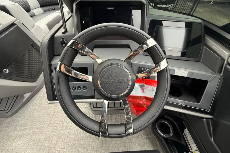 Slide: The Image of Steering wheel of 2026 Avalon Excalibur LTD Quad Lounger Shift with modern dashboard. - 39