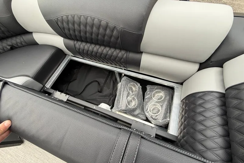 Slide: The Image of 2026 Avalon Excalibur LTD Quad Lounger Shift with under-seat storage and cup holders. - 48