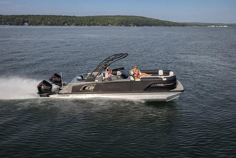 Slide: The Image of 2026 Avalon Excalibur LTD Quad Lounger Shift pontoon boat at dealership. - 5