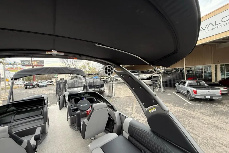 Slide: The Image of 2026 Avalon Excalibur LTD Quad Lounger Shift pontoon boat interior at dealership. - 51