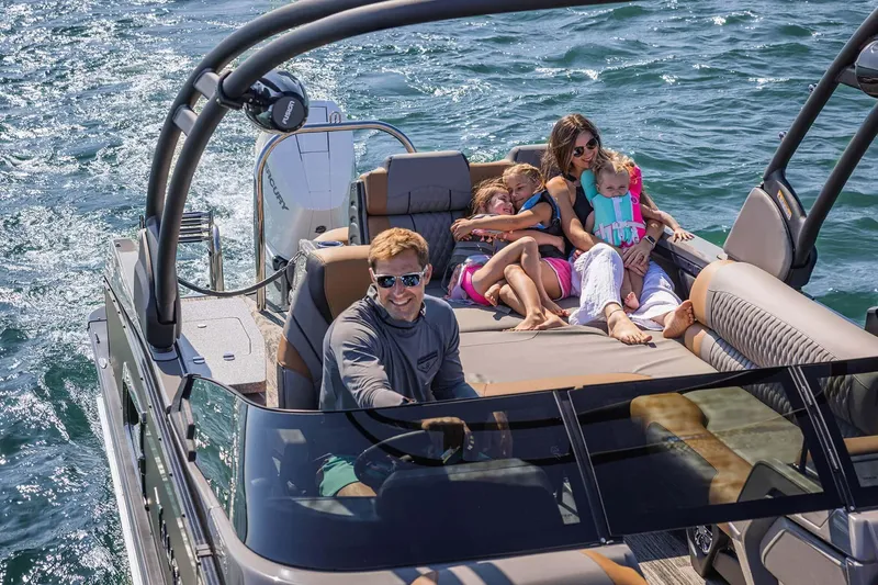 Slide: The Image of Close-up of 2026 Avalon Excalibur LTD Quad Lounger Shift emblem with carbon fiber detail. - 8