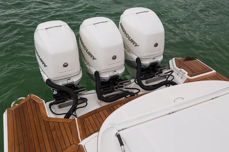 Slide: The Image of 2018 Sea Ray SLX 350 Outboard dashboard with steering wheel and digital displays. - 15
