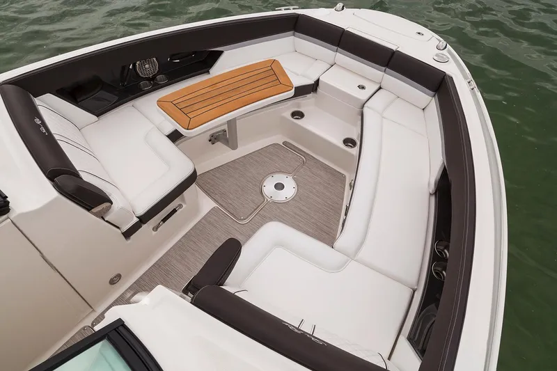 Slide: The Image of 2018 Sea Ray SLX 350 Outboard cruising on water with city skyline in background. - 5