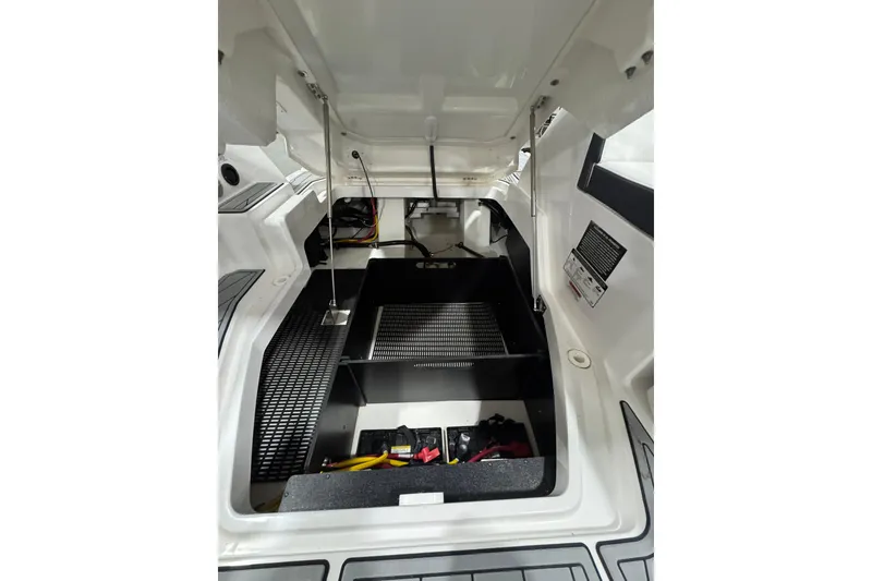 Slide: The Image of 2023 Monterey 255SS Super Sport engine compartment with open hatch, showcasing interior components. - 10