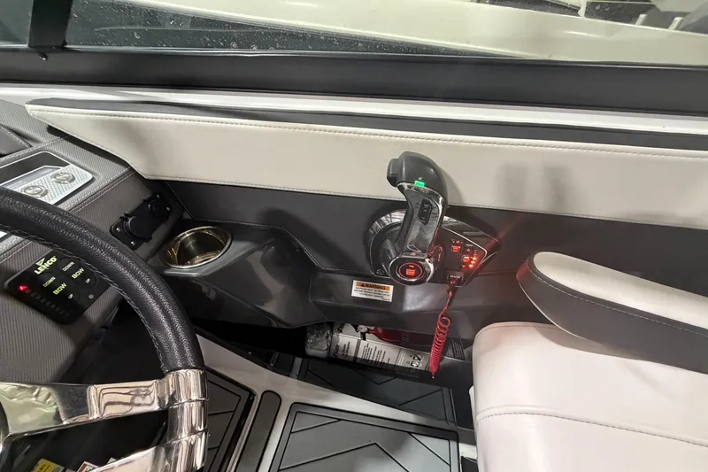 Slide: The Image of Interior of 2023 Monterey 255SS Super Sport boat with steering wheel and controls. - 17