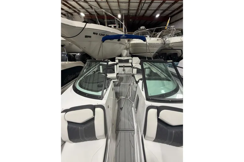 Slide: The Image of 2023 Monterey 255SS Super Sport boat in storage, featuring sleek design and modern interior. - 20