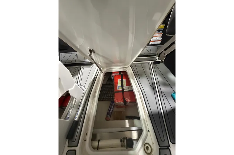 Slide: The Image of 2023 Monterey 255SS Super Sport boat storage compartment with open hatch. - 21
