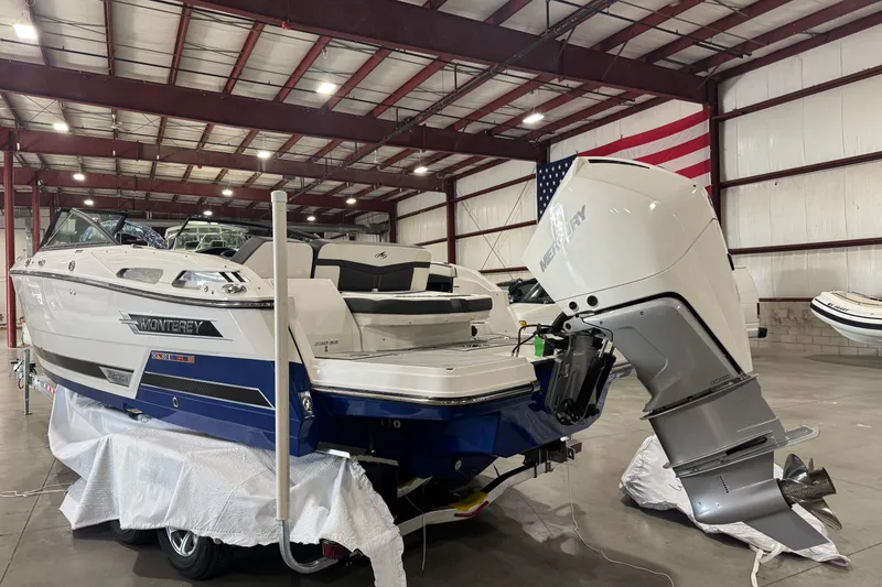 Slide: The Image of 2023 Monterey 255SS Super Sport boat in warehouse with Mercury outboard engine. - 26