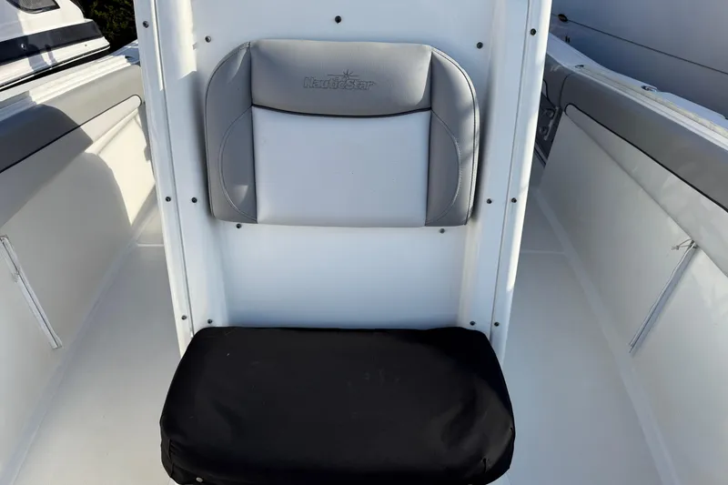 Slide: The Image of 2021 NauticStar 28 XS boat seat with gray and black cushions. - 16