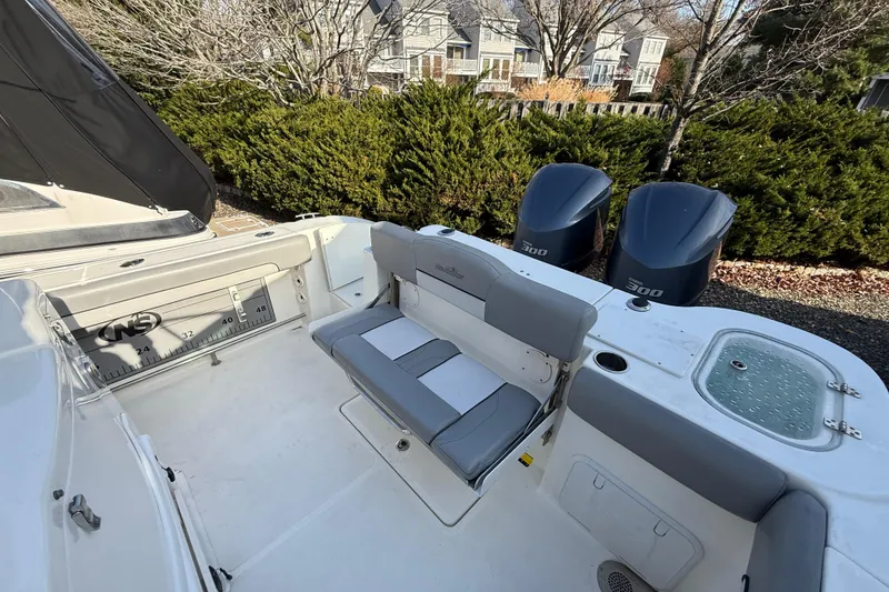 Slide: The Image of 2021 NauticStar 28 XS boat interior with dual 300 engines and seating area. - 20