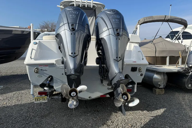 Slide: The Image of 2021 NauticStar 28 XS boat with dual Yamaha 250 V6 outboard engines. - 30