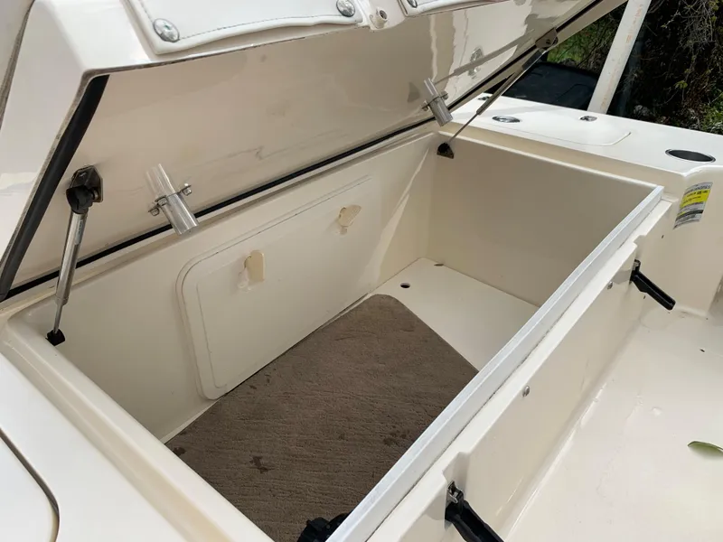Slide: The Image of Open storage compartment on a 2006 Scout 170 Costa boat. - 12