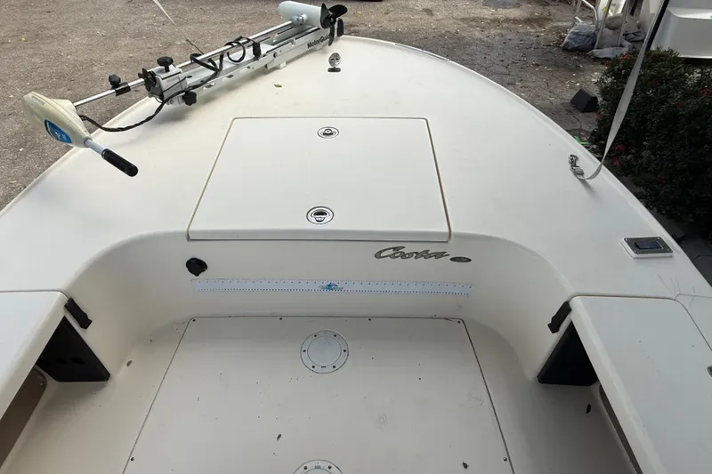 Slide: The Image of 2006 Scout 170 Costa boat deck with storage compartments and trolling motor. - 23