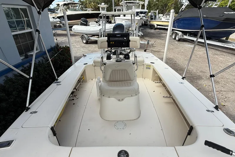 Slide: The Image of 2006 Scout 170 Costa boat interior with seating and control panel, parked outdoors. - 29