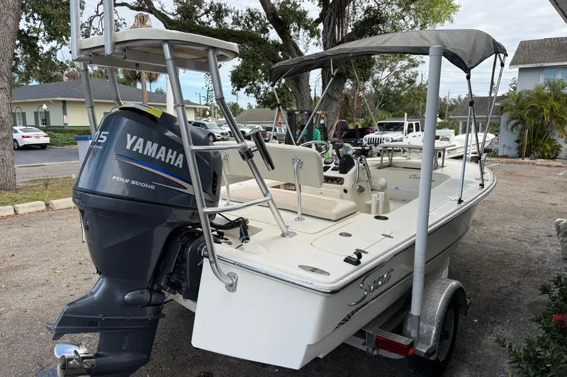 Slide: The Image of 2006 Scout 170 Costa boat with Yamaha 115 outboard motor, parked on a trailer. - 3