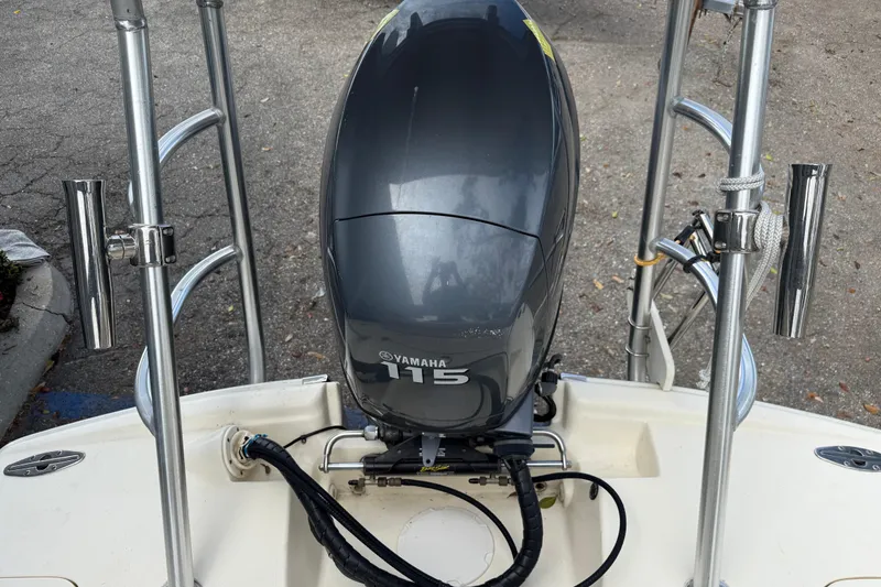 Slide: The Image of 2006 Scout 170 Costa boat with Yamaha 115 outboard motor, docked on pavement. - 9