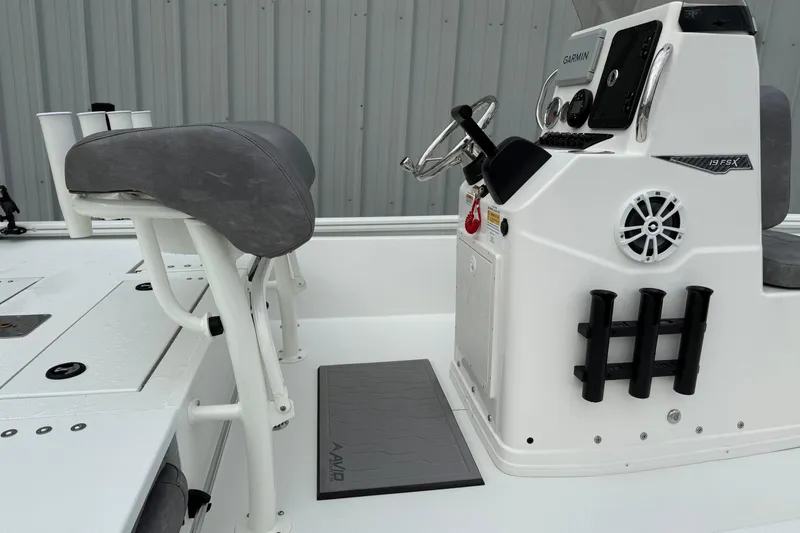 Slide: The Image of 2026 Avid 19 FSX boat console with steering wheel and seating. - 4