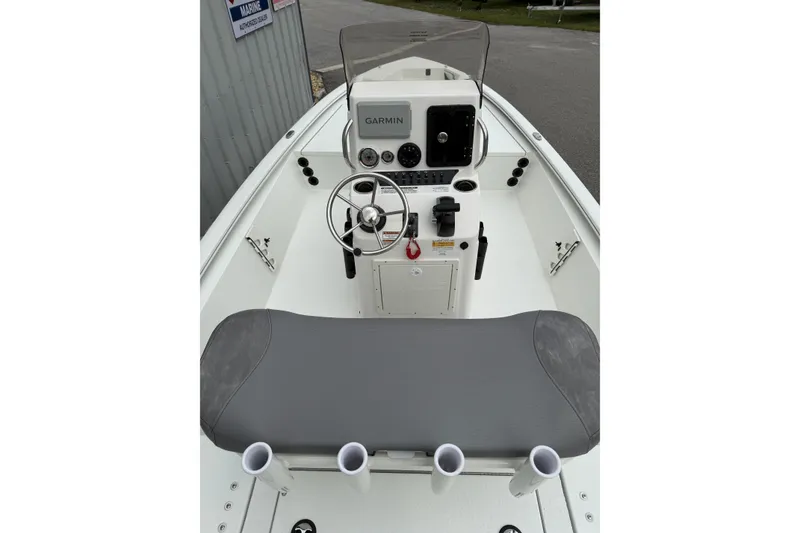 Slide: The Image of 2026 Avid 19 FSX boat interior with steering console and Garmin navigation system. - 6