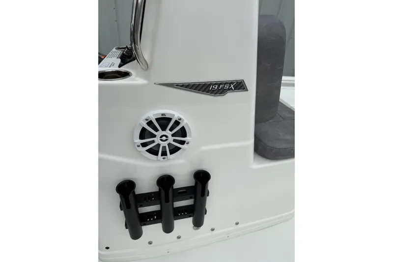 Slide: The Image of 2026 Avid 19 FSX boat console with speaker and rod holders. - 7