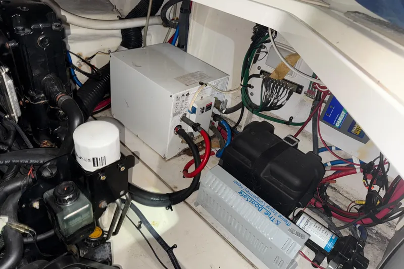 Slide: The Image of 2006 Sea Ray 260 Sundancer boat on trailer, parked in suburban neighborhood. - 10