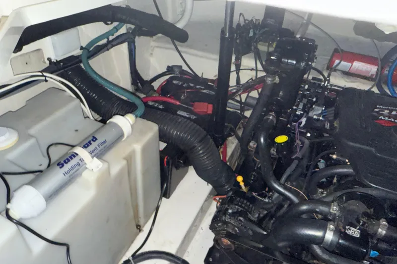 Slide: The Image of 2006 Sea Ray 260 Sundancer boat on trailer, parked in suburban neighborhood. - 11