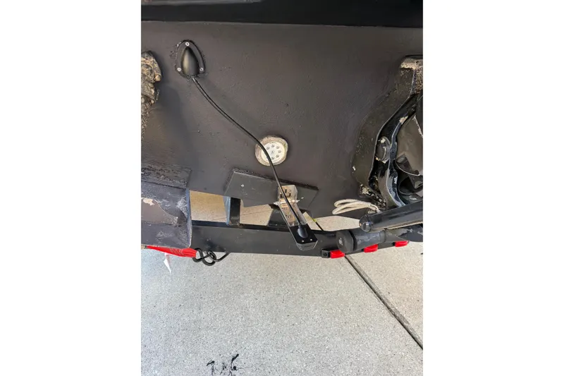 Slide: The Image of Close-up of 2006 Sea Ray 260 Sundancer boat's stern with trim tab and wiring. - 22