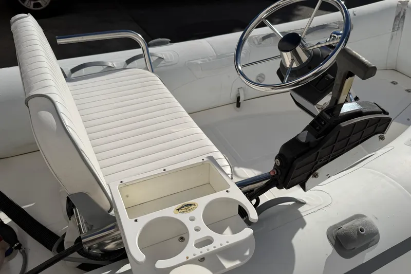 Slide: The Image of 2013 AB Inflatables 10VST boat interior with steering wheel and seating. - 5